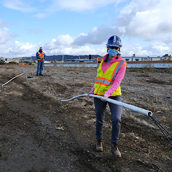 Running piezometer cable through pipe