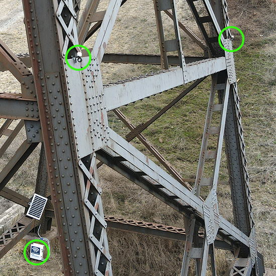 Co-located prisms and tiltmeters on steel pier