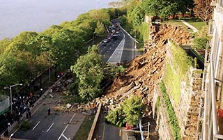 Failure of retaining wall closed highway